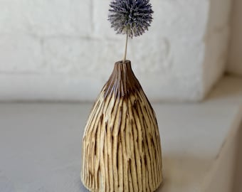 Hand-carved vessel for a single-stemmed flower, dried or fresh