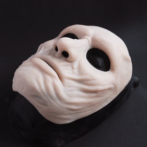 Ghoul Mask in vanilla shade on a black surface at an angle