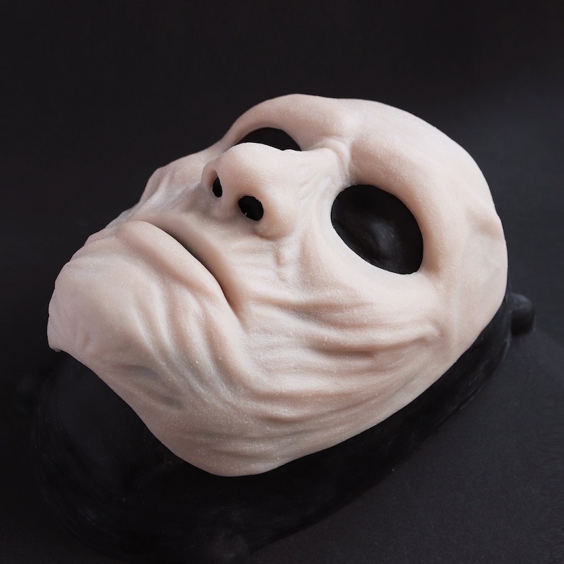 Ghoul Mask in vanilla shade on a black surface at an angle