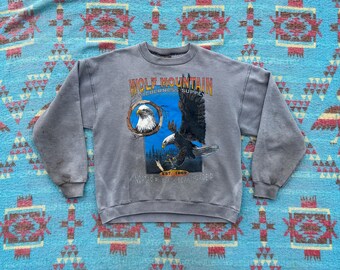 Sudadera vintage de los 90 con estampado de águila calva y montaña Wolf
