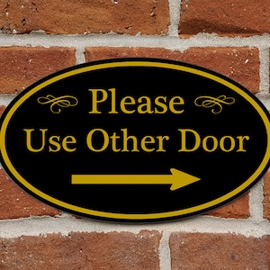 Please Use Other Door Sign With Right Arrow - Aluminum Oval 12&quot; x 7&quot; Plaque - Variety of Colors Available