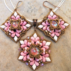 May include: A pink and white beaded jewelry set with a pendant and earrings. The pendant and earrings are shaped like a flower with a crystal in the center.