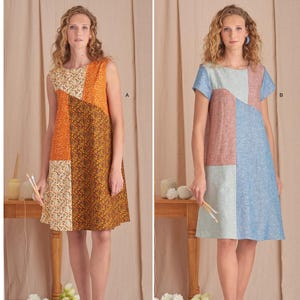 May include: Simplicity sewing pattern S9615 featuring two patchwork dresses. One sleeveless dress has orange, brown, and floral panels. The other dress has short sleeves and panels of blue, pink, and gray. The text "easy-to-sew" is visible.