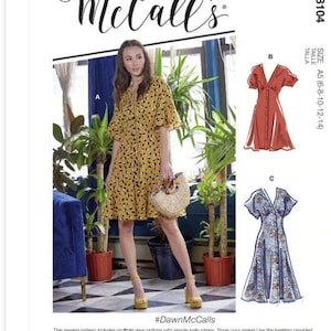 May include: A sewing pattern for a dress with three different views. The dress is shown in yellow with black polka dots, red, and blue floral print. The pattern includes sizes A5 (6-8-10-12-14). The pattern is called McCall's #M8104 and includes the hashtag #DawnMcCalls.