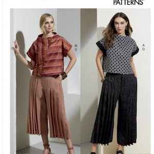 May include: Vogue Patterns sewing pattern for a women's top and culottes. The top has a boat neck and short sleeves. The culottes are wide-legged and pleated. The pattern is available in all sizes.