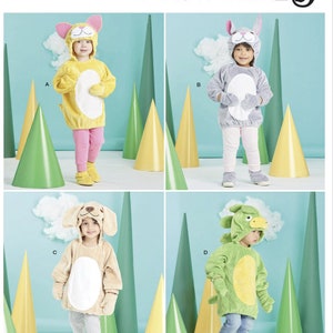 May include: A sewing pattern for four children's costumes. The pattern includes a cat, bunny, dog, and dinosaur costume. The pattern is from Simplicity and has the number S9624 printed on it.