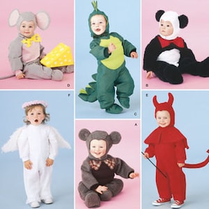 May include: Simplicity 2506 sewing pattern for toddler costumes. The image displays six variations: a gray mouse with yellow cheese, a green dragon, a black and white panda, a white angel with wings, a brown bear, and a red devil with a tail.