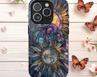 May include: A phone case with a stained-glass sun and moon design in blue, purple, and gold. The sun has a face in the center. The case has a black camera module. Butterflies and flowers are in the background. The case is designed for a smartphone.
