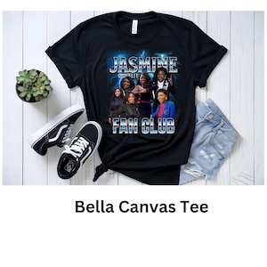 May include: Black Bella Canvas t-shirt with a graphic print of five women with the text "Jasmine Fan Club" in silver letters with a lightning bolt design.