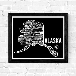 May include: Black and white typography map of Alaska with the state name and compass rose. The map is filled with city names and points of interest.