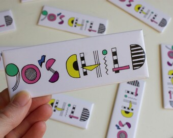 May include: A white rectangular tile with the text "90's CHILD" in black and colorful geometric shapes. The tile has a pink, yellow, green, and black color scheme.