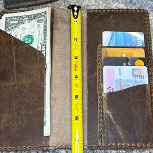 This photo shows the rodeo wall open and that it measures 7 inches tall.