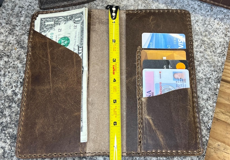 This photo shows the rodeo wall open and that it measures 7 inches tall.