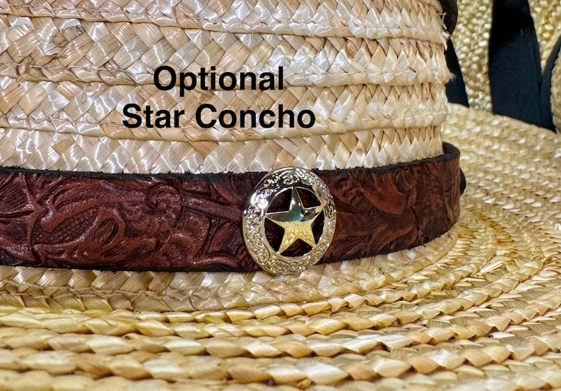 May include: Close-up of a straw cowboy hat with a brown leather band featuring a floral design. A silver star concho is attached to the band. The text "Optional Star Concho" is visible on the hat.