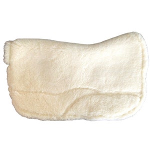 May include: A white sheepskin saddle pad with a soft, fluffy texture. The pad is designed to provide extra cushioning and comfort for the horse.