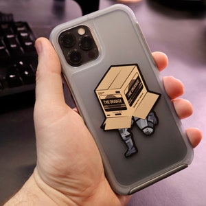 Metal Gear Solid Snake - Caixa de papelão - 3 x 2,5 polegadas - a caixa laranja furtiva - decalque para laptop de ação de espionagem do chefão