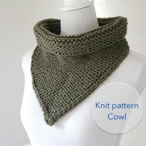 May include: A green knitted cowl neck scarf. Knit pattern cowl.