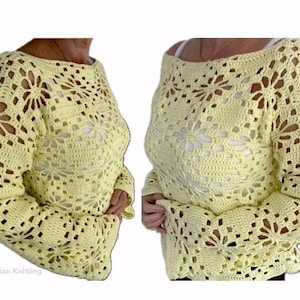 Puede incluir: Un su&eacute;ter de crochet amarillo con un patr&oacute;n de encaje. El su&eacute;ter tiene mangas largas y un ajuste holgado.