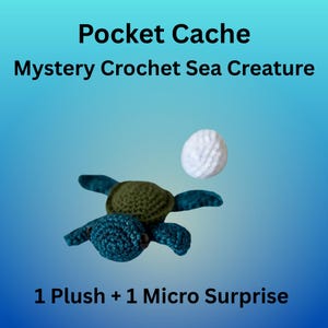 May include: A crocheted sea turtle plush toy with a white ball on a gradient blue background. The turtle has a green shell and blue flippers and head. Text reads "Pocket Cache Mystery Crochet Sea Creature" and "1 Plush + 1 Micro Surprise."
