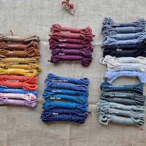 May include: Assortment of cotton rope in various colors, including terracotta, maroon, merlot, grape, dark gray, light gray, black, beige, off-white, bright snow white, denim blue, light teal, dark teal, navy, emerald green, dark olive green, light sage, and dark sage.