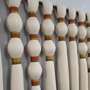 macrame wall hanging, yarn tassels string art