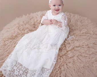 Baptism gown for baby girl, with see through puffed up sleeves, with 3 buttons at the front. Floral lace blessing dress