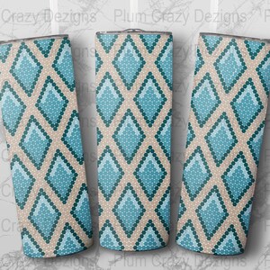 May include: Three stainless steel tumblers with a geometric pattern of blue and beige diamonds. The pattern is made up of small circles.