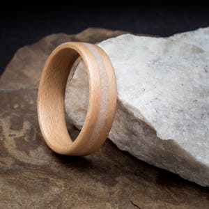 The Isle of Skye ring, made with ash and featuring a Skye marble inlay