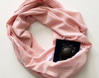 Hidden pocket infinity scarf.  Soft Pink with small white Stripe Infinity Scarf With secret zipper pocket. 100% Polyester.