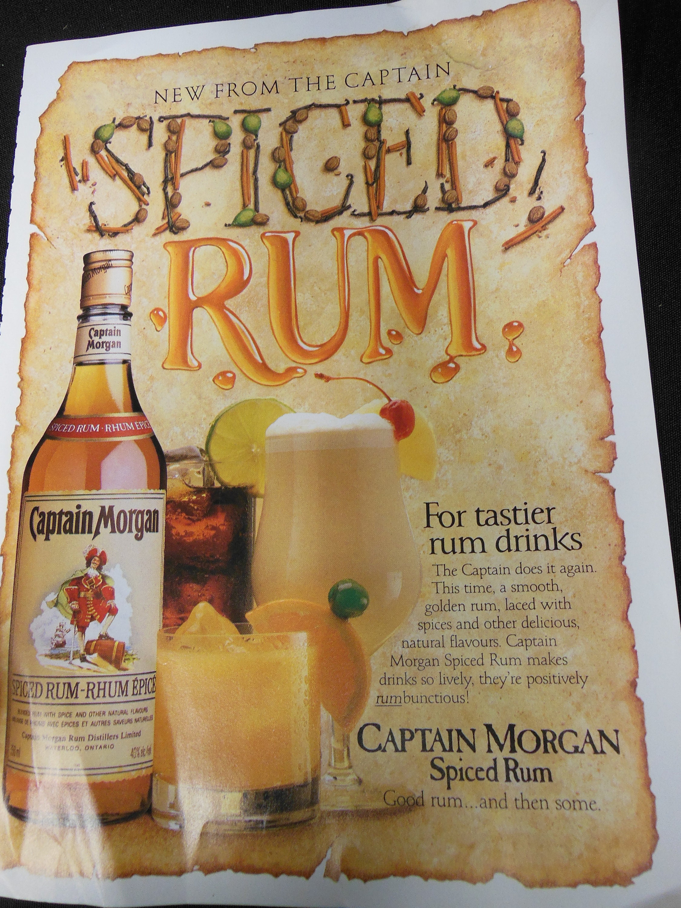 Vintage 1980s De Luxe Rum Captain Morgan Rhum in gold & dark 8 by 11 ready for framing inexpensive shipping, magazine ad