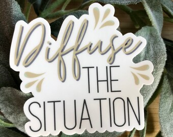 May include: White sticker with a gold and grey outline. The sticker says "Diffuse the Situation" with a decorative flourish.