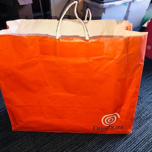 Sega Dreamcast Einkaufstasche Orange 1998 Produkteinführung Werbepapier Promo-Logo