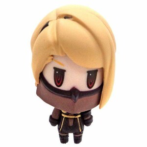 May include: A small, brown and black figurine of a female character with blonde hair. The character is wearing a black outfit with gold accents and has a black mask over her eyes.