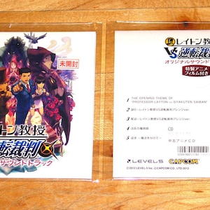 Professor Layton vs. Ace Attorney originalmusik-CD med mobilfilmstrip 3DS