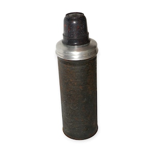 May include: An antique thermos bottle with a dark brown, ribbed exterior. The top is black with red speckles, and it has a silver-colored metal band. The thermos is cylindrical and appears to be made of metal and plastic.