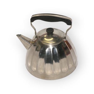 May include: A polished stainless steel kettle with a black handle and lid knob. The kettle features a ridged, rounded body and a pouring spout. The handle curves over the top, and the lid has a small, round knob.