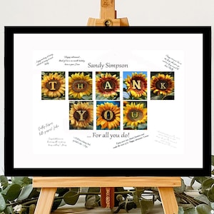 May include: A black framed white poster with the words "Thank You" spelled out using sunflower images. The poster is on a small wooden easel and has the name "Sandy Simpson" at the top. The text "...For all you do!" is at the bottom of the poster.