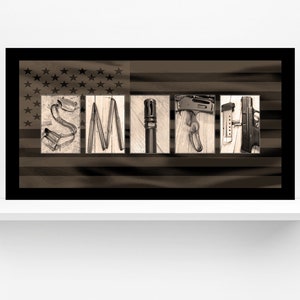 May include: A framed print of the word "SMITH" spelled out using various tools and weapons, set against a faded American flag background.