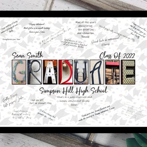 May include: A framed graduation print with the word "GRADUATE" spelled out in colorful letters. The print includes the graduate's name, school, and the year "2022". Handwritten messages surround the text, adding a personal touch.