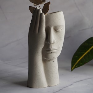 Abstract concrete vase | face