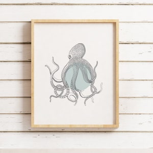 May include: A framed print of a black and white line drawing of an octopus with a light blue circle behind it.