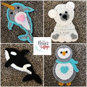 May include: A set of four crocheted animal appliques. The appliques are a narwhal, a polar bear, an orca, and a penguin. The narwhal is blue and white with a pink heart. The polar bear is white with gray accents. The orca is black and white. The penguin is gray and white with a blue scarf and a turquoise heart.
