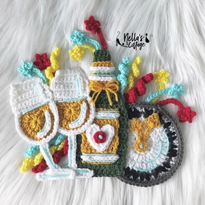 May include: Crocheted bottle, two wine glasses, and a round coaster with a white and black design. The bottle and glasses are decorated with colorful yarn and beads. The coaster has a white center with a black border.