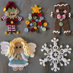 May include: A collection of five crocheted Christmas ornaments. Includes an elf, a Christmas tree with colorful baubles, a gingerbread person with a pink bow tie, an angel, and a snowflake. The ornaments are handmade and feature various colors.