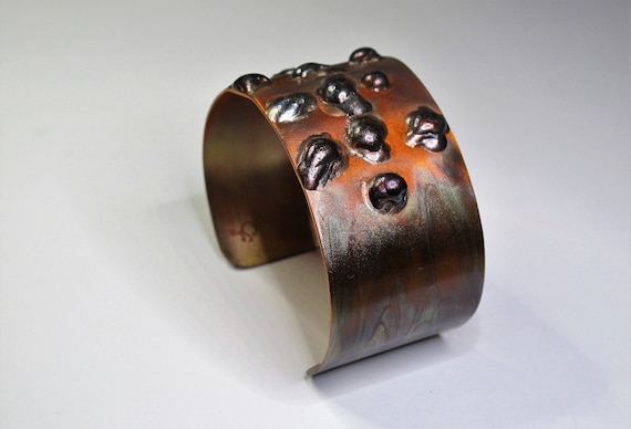 Copper Bracelet. The cuff is flame painted with a jewelry torch and covered by a protective coat, flame paint copper, adjustable
