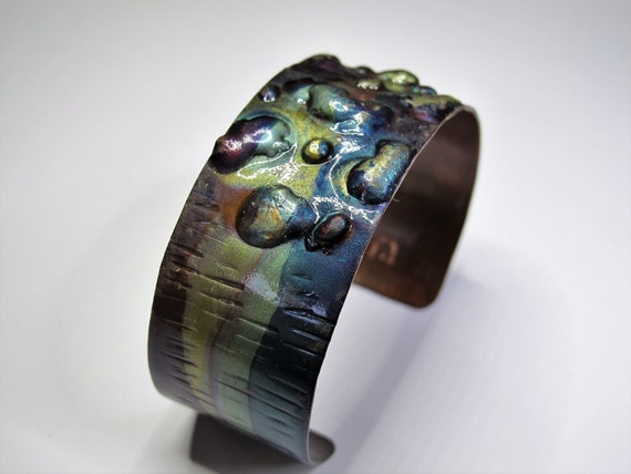 Copper Bracelet flame painted, blue and green colors. The cuff is flame painted with a torch and covered by a protective coat