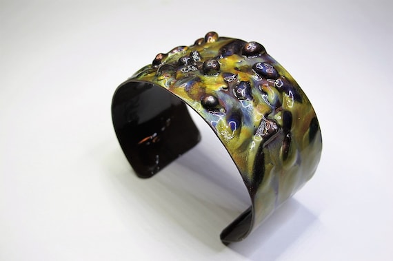 Copper Bracelet flame painted. The cuff is flame painted with a torch and covered by a protective coat