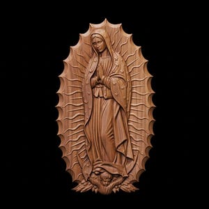 May include: A wooden carving of a religious figure, depicting a woman in a flowing gown with hands clasped in prayer. The figure is surrounded by a sunburst design. The carving is in a warm brown tone against a black background.