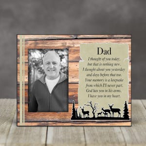 May include: A wooden picture frame with a beige background and a black and white photo of a man. The frame has a poem about remembering a loved one printed on the right side. The poem reads: "Dad I thought of you today, but that is nothing new. I thought about you yesterday and days before that too. Your memory is a keepsake from which I'll never part. God has you in his arms, I have you in my heart."