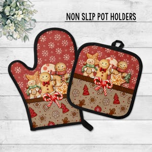 May include: A red and brown oven mitt and pot holder set with a black trim. The set features a gingerbread man design with snowflakes and candy canes. The text "NON SLIP POT HOLDERS" is printed at the top.